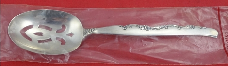 Pierced Serving Spoon factory sealed  8 1/4